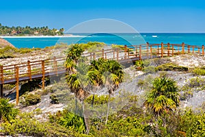 The bridge to the sandy beach Playa Paradise of the island of Cayo Largo, Cuba. Copy space for text.