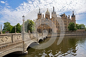 Bridge to the Schwerin Castle or Schwerin palace, in German Schweriner Schloss, a romantic landmark building on a lake in the