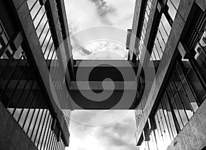 A bridge between two modern concrete buildings