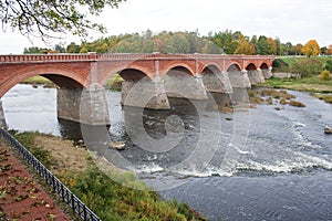 A bridge on the Venta River in Kuldiga Latvia photo