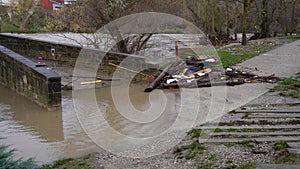 the bridge was flooded with water and filled with logs that carried the current. photo