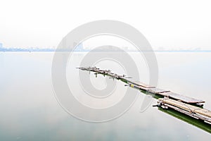 Bridge in west lake in fog, Hanoi, Vietnam