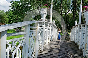 Bridge wiggle railings and girl resting at bridge photo
