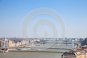 Bridges of Erzsebet, Szabadsag and Petofi Hid over the Danube in Budapest, Hungary, seen from above, during a warm afternoon.