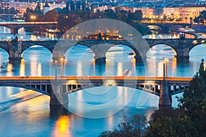 Bridges with historic Charles Bridge and Vltava river at night in Prague, Czech Republic