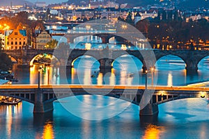 Bridges with historic Charles Bridge and Vltava river at night in Prague