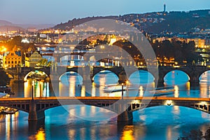 Bridges with historic Charles Bridge and Vltava river at night in Prague