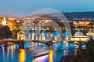 Bridges with historic Charles Bridge and Vltava river at night in Prague