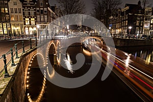 Bridges at the Leidsegracht and Keizersgracht canals intersection in Amsterdam photo