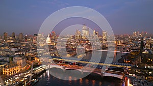 The bridges over River Thames in London - aerial view at sunset