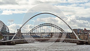 Bridges over River Tyne - the Gateshead Millennium Bridge and Tyne Bridge, Newcastle upon Tyne, UK