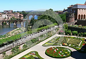 Bridges and part of the city of Albi with the gardens of the bishopric in the forground photo