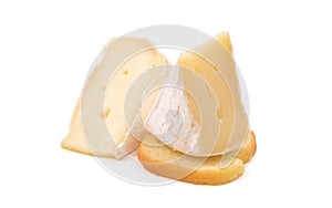 Brie cheese. Camembert cheese. Fresh Brie cheese on a piece of bread. Baguette crackers.