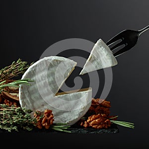 Brie cheese and fork with triangle piece