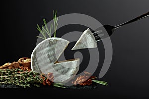 Brie cheese and fork with triangle piece