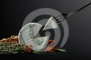 Brie cheese and fork with triangle piece