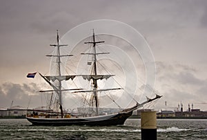 Brig on the river in heavy rain