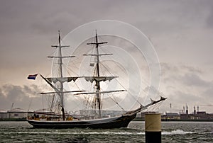 Brig on the river in heavy rain
