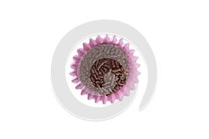 Brigadeiro is a chocolate truffle from Brazil. Cocoa and sprinkles of chocolate. Children birthday party sweet. Top view