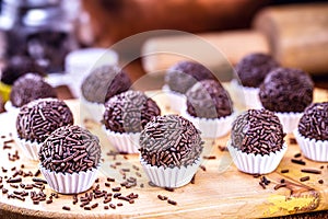 Brigadeiro or negrinho, a Brazilian chocolate bonbon typical of children`s birthday parties photo