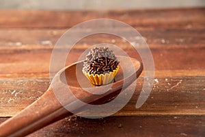 Brigadeiro (Brigadeiro) Traditional Brazilian sweet. Lined up on a wooden board photo