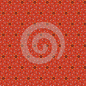 Bright abstract geometric fabric pattern with blue, yellow, white and black polka dots on rustic orange red background