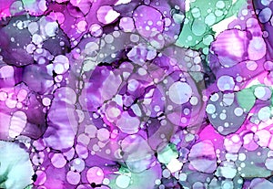Bright abstract hand drawn watercolor or alcohol ink background in purple and green tones. Raster illustration.