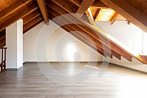 Bright attic with wooden beams and parquet