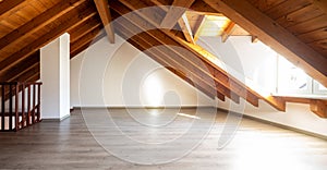 Bright attic with wooden beams and parquet