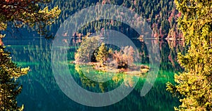 Bright autumn panorama of Eibsee lake. Sunny morning view of small island on bottom of the Zugspitze peak, Bavaria, Germany,