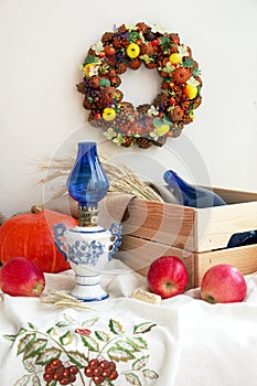 Bright autumn wreath made from natural materials. Handmade autumn decor.