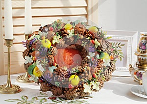 Bright autumn wreath made from natural materials. Handmade autumn decor.