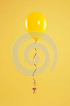 Bright balloon on color background