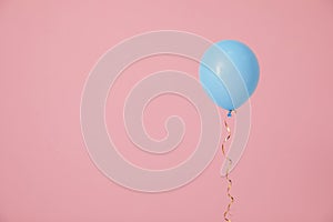 Bright balloon on color background, space for text