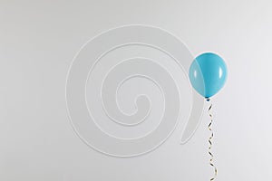 Bright balloon on light background. Celebration time