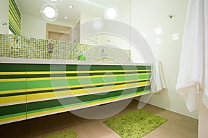 Bright bathroom with green elements