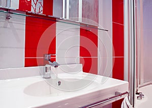 Bright bathroom interior in red and white colors