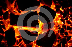 Bright beautiful background consisting of pieces of burning coal.