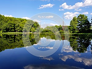 A bright beautiful day with reflection of clouds at Foley Pond near Banning Park, Wilmington, Delaware, U.S.A