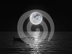 Bright and beautiful dramatic super moon over the ocean with small boat and reflection of bright light in black and white. Image