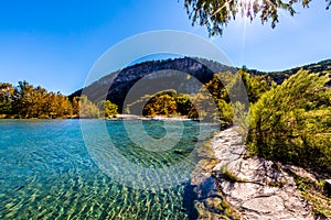 Bright Beautiful Fall Foliage on the Crystal Clear Frio River. photo