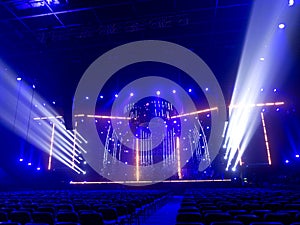 Bright beautiful rays of light on an stage before the concert.