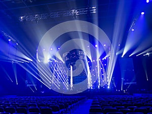 Bright beautiful rays of light on an stage before the concert.