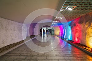 Bright beautiful underpass with colorful illumination in center of city