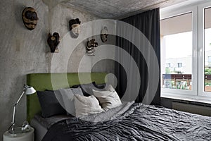 Bright bedroom with exposed concrete