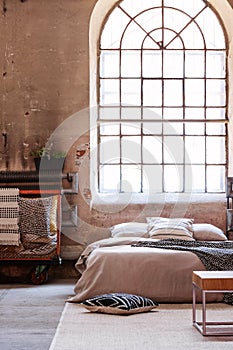 Bright bedroom with industrial window