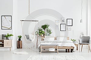 Bright bedroom interior with hammock