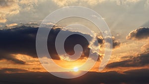 Bright big sun on the sky with yellow orange gradient colors, beautiful sunset cloudy sky