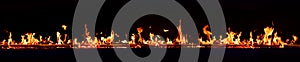 Horizontal fire flames with dark background