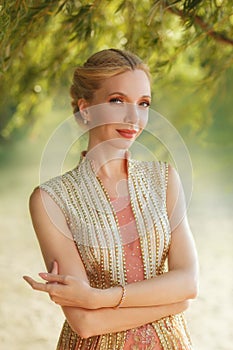 Bright blonde girl portrait with blond blonde hair and nude makeup, soft features and a cute smile, elf hairstyle, looks